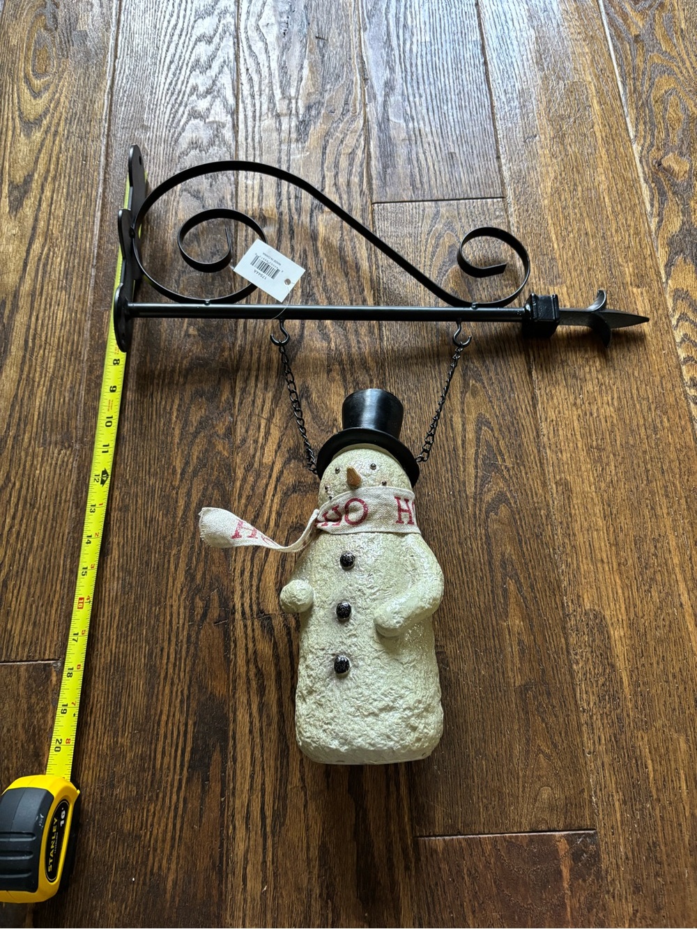 Festive Cream Snowman Hanging Decoration with Black Metal Bracket